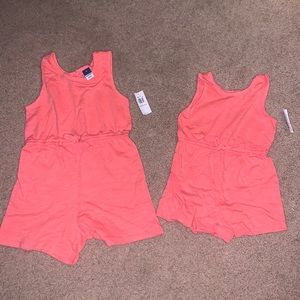 Two brand new with tags old navy salmon rompers.